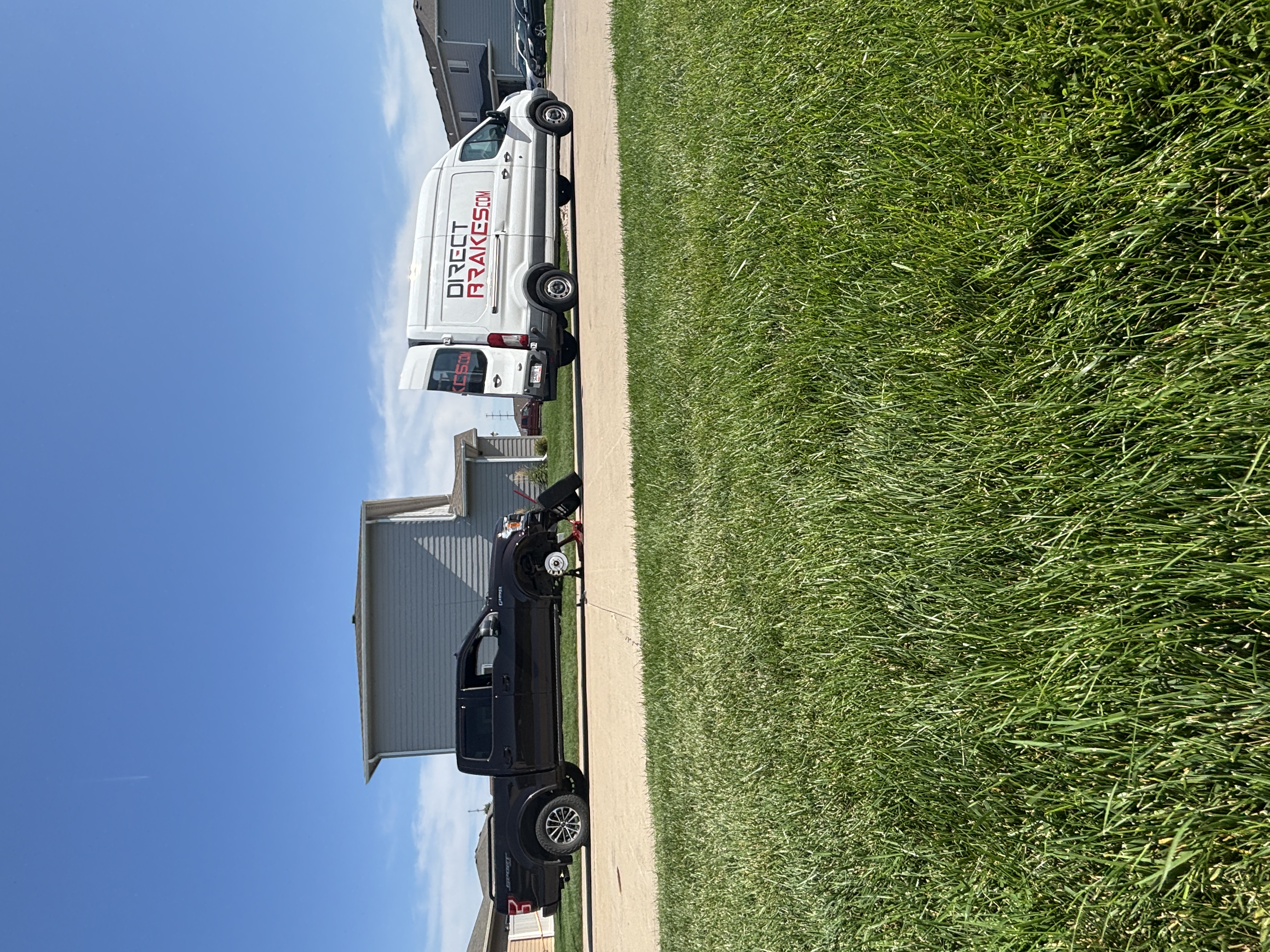 Direct Brakes technician replacing Ford battery in Sioux Falls