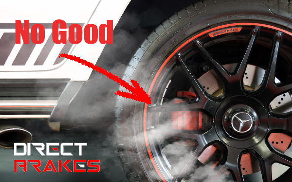 Brake rotor glowing red-orange from overheating — cause of burning smell from brakes