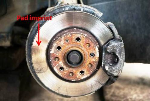 Car steering wheel vibrating when braking due to warped rotors