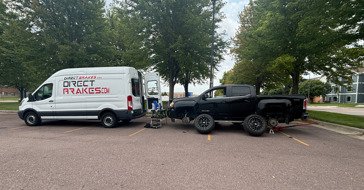 Mechanic working on car brakes