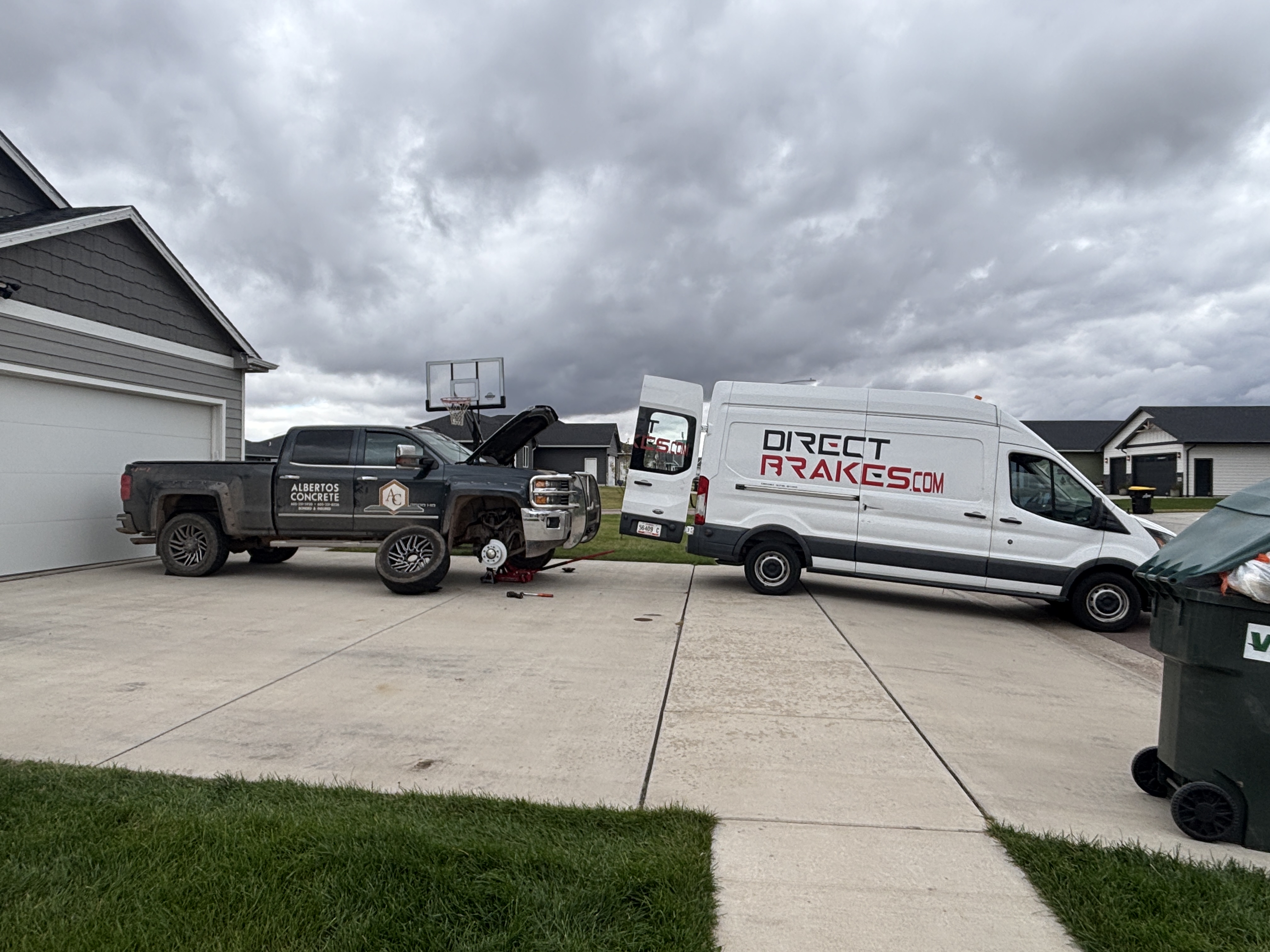 Construction work trucks lined up for fleet maintenance service