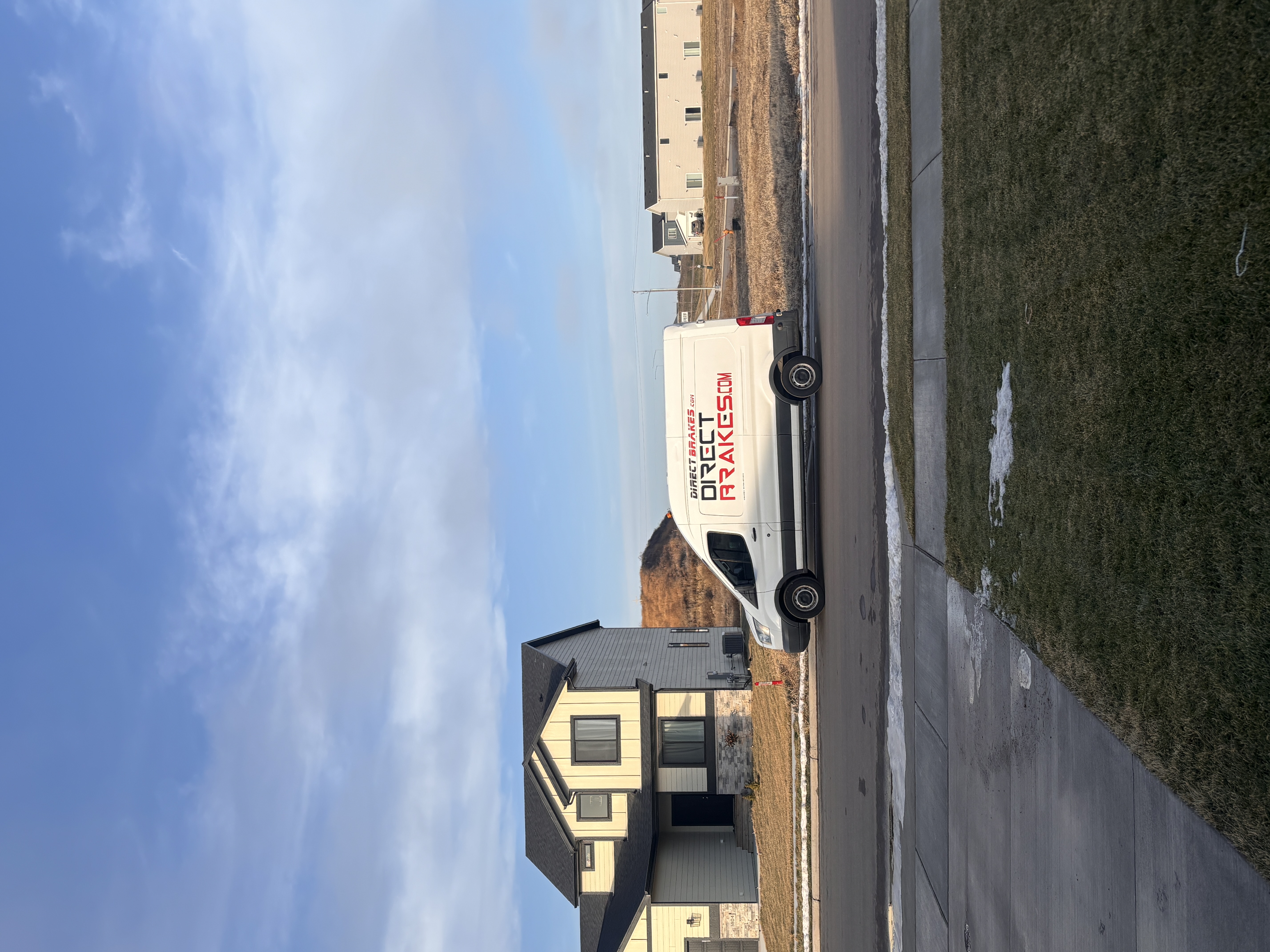 Mobile fleet maintenance technician servicing company vehicles at business location