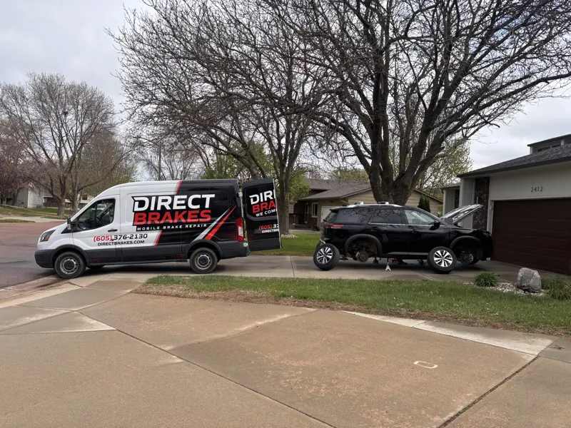 Direct Brakes mobile brake repair van servicing SUV in customer driveway