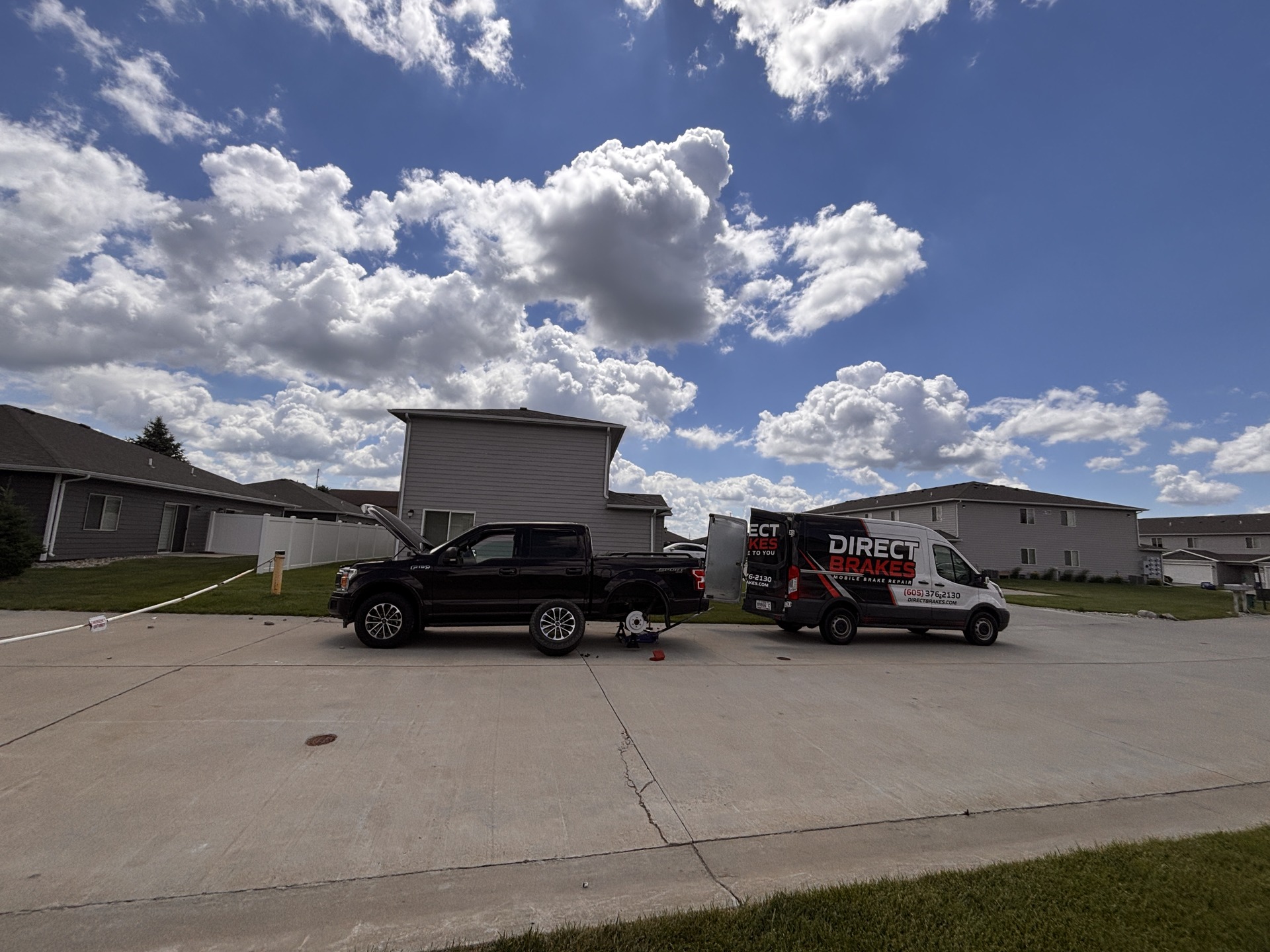 Direct Brakes technician replacing brake pads and rotors in Omaha