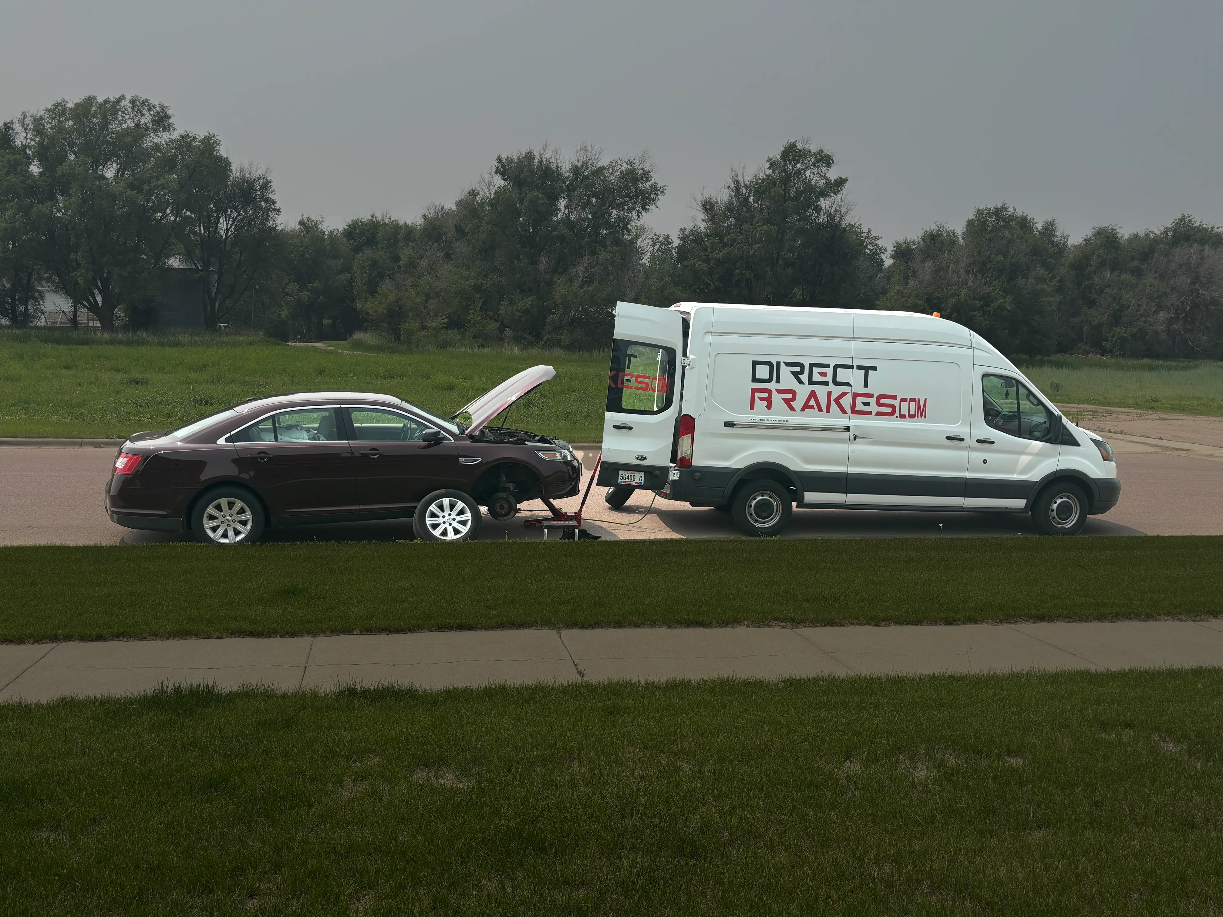 Mobile brake repair near me — Direct Brakes technician servicing vehicle at Sioux Falls SD home