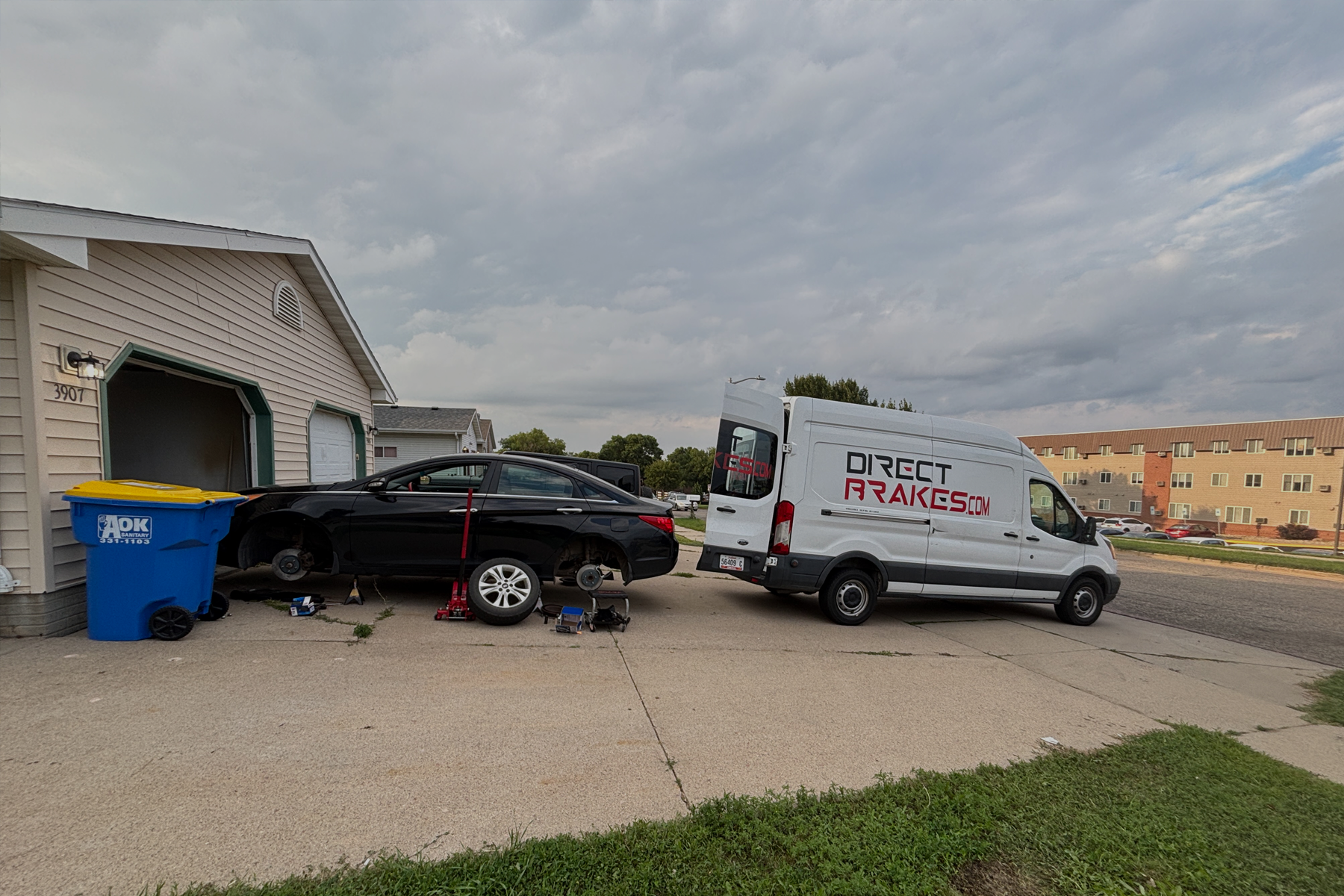 Direct Brakes technician performing brake inspection on vehicle in Omaha Nebraska