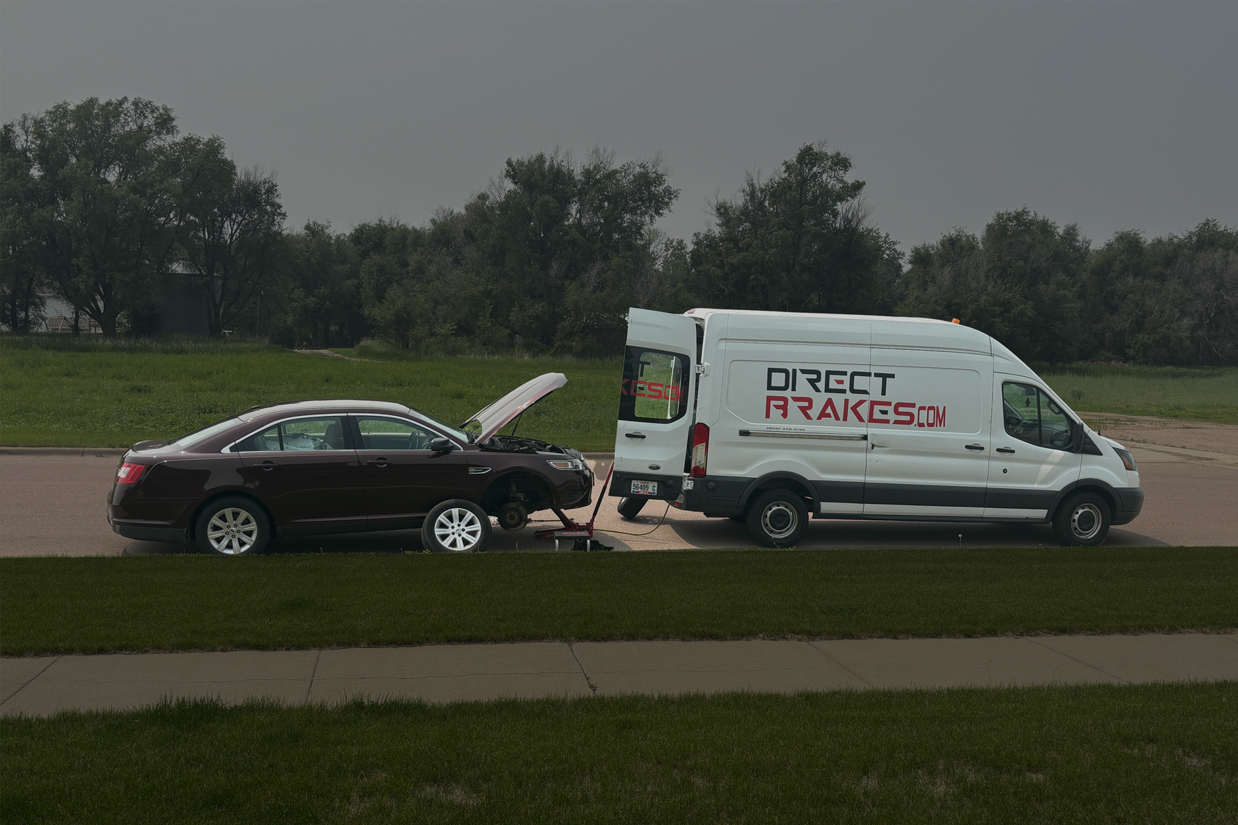 Direct Brakes technician replacing brake pads on vehicle in Omaha Nebraska