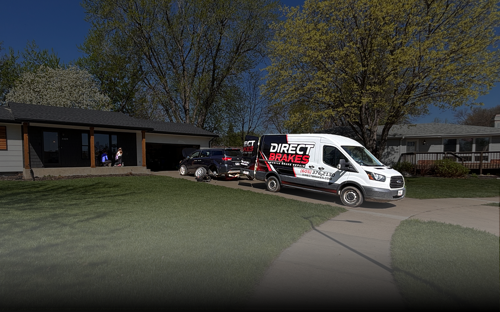 Direct Brakes mobile brake repair technician servicing customer vehicle in Sioux Falls driveway