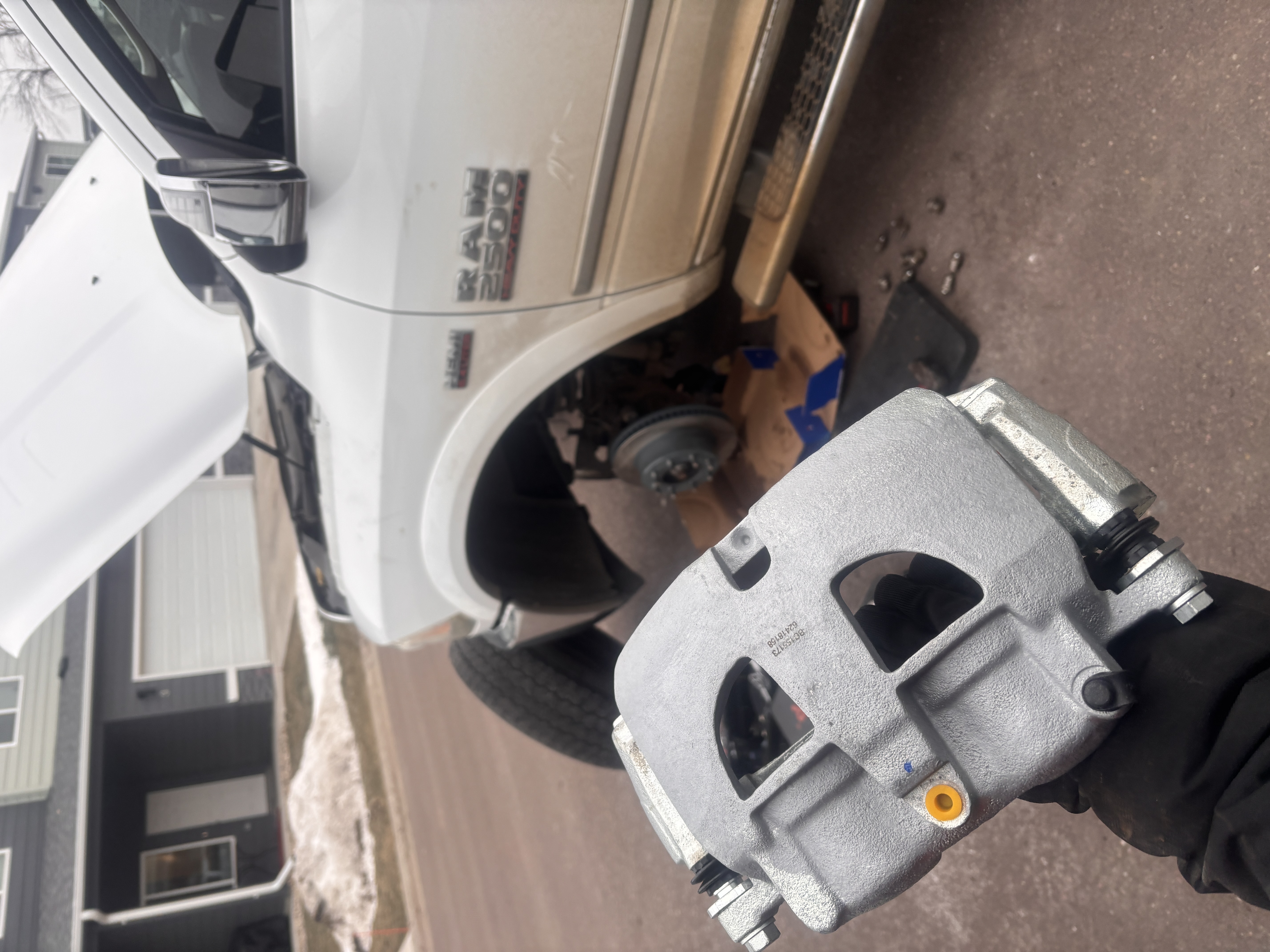 Close-up of brake hose and caliper connection