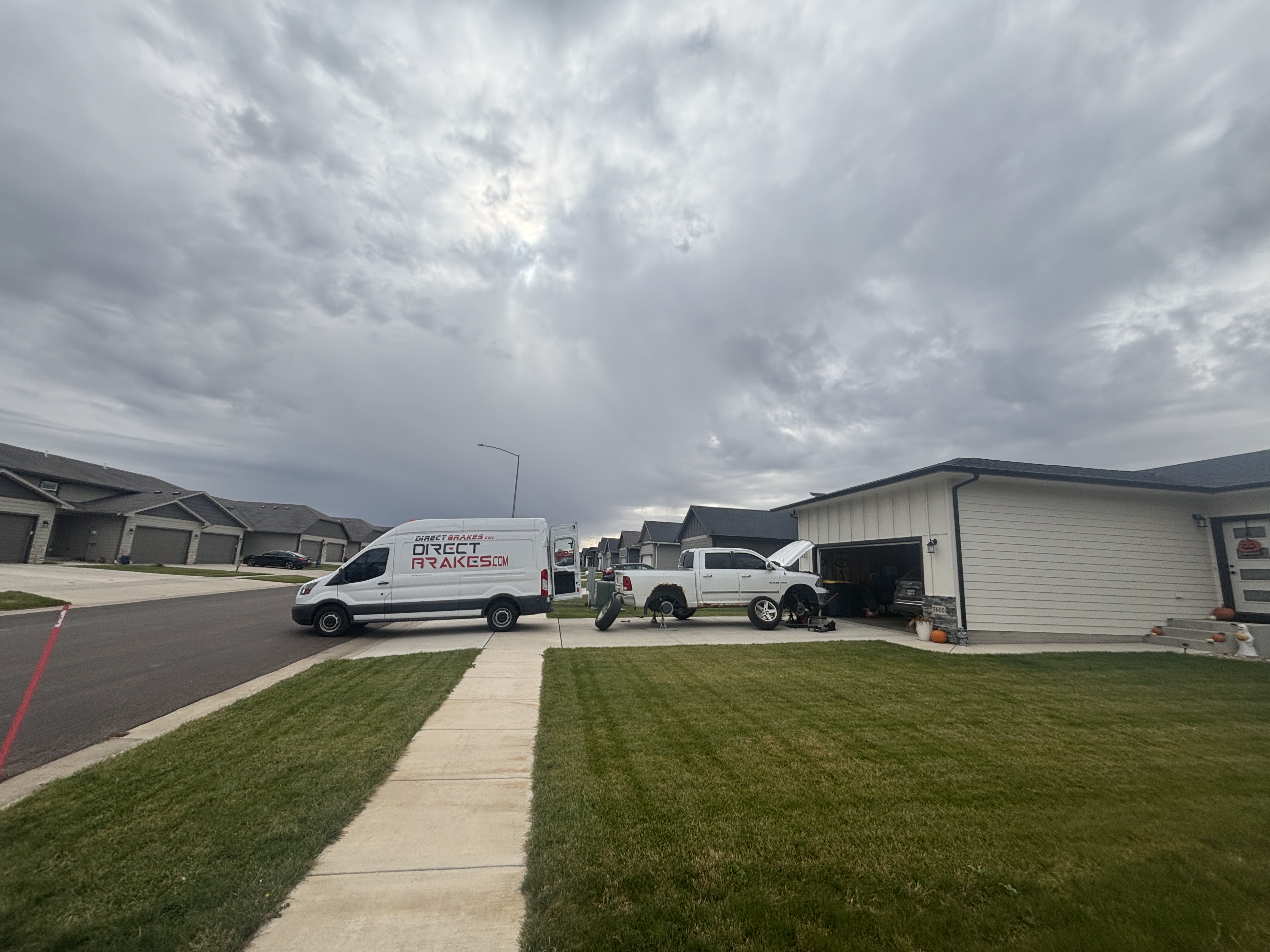 Direct Brakes Mobile Repair technician performing brake fluid flush at customer home in Sioux Falls