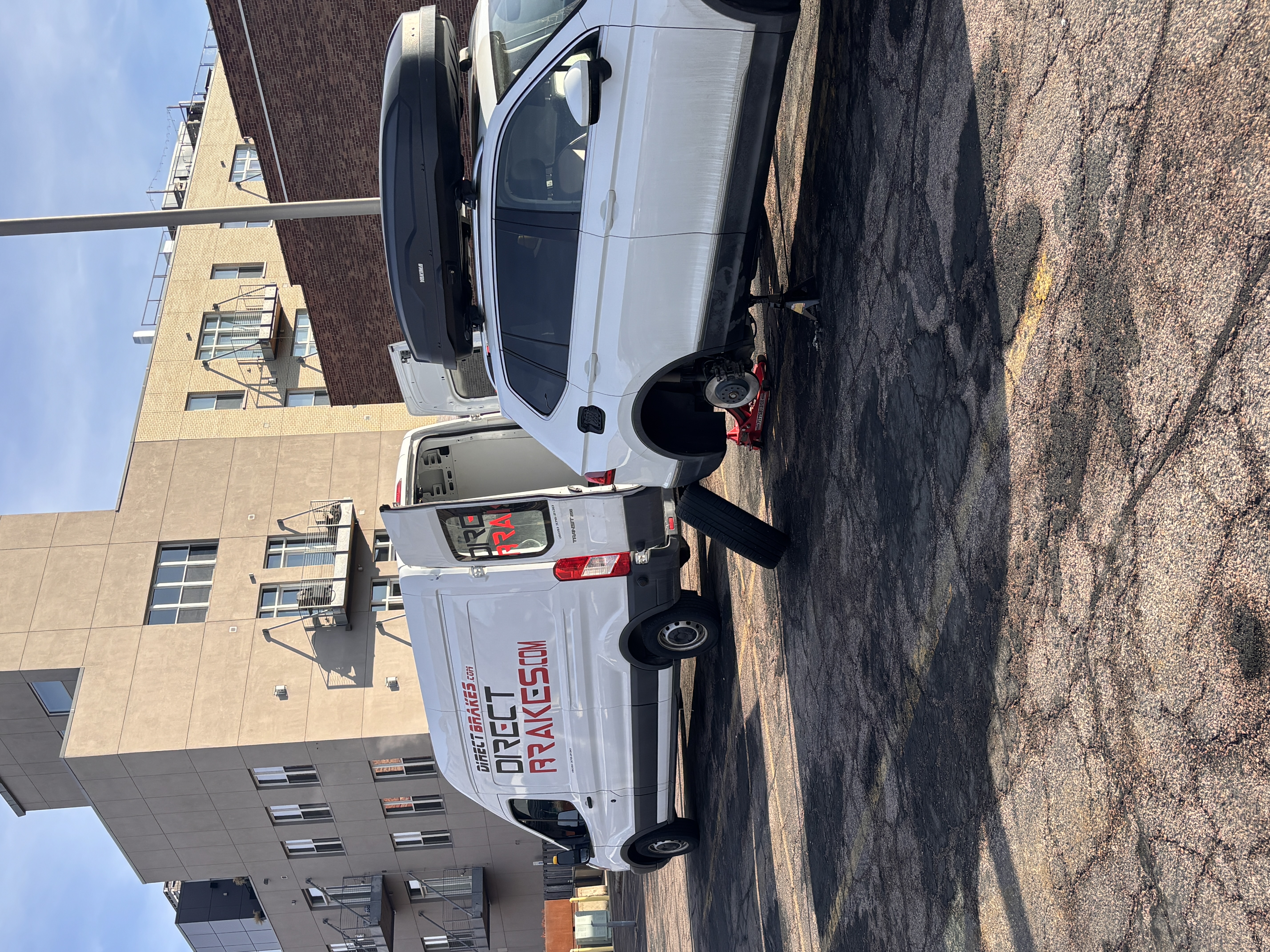 Direct Brakes Mobile Repair technician replacing brake caliper at customer home in Sioux Falls