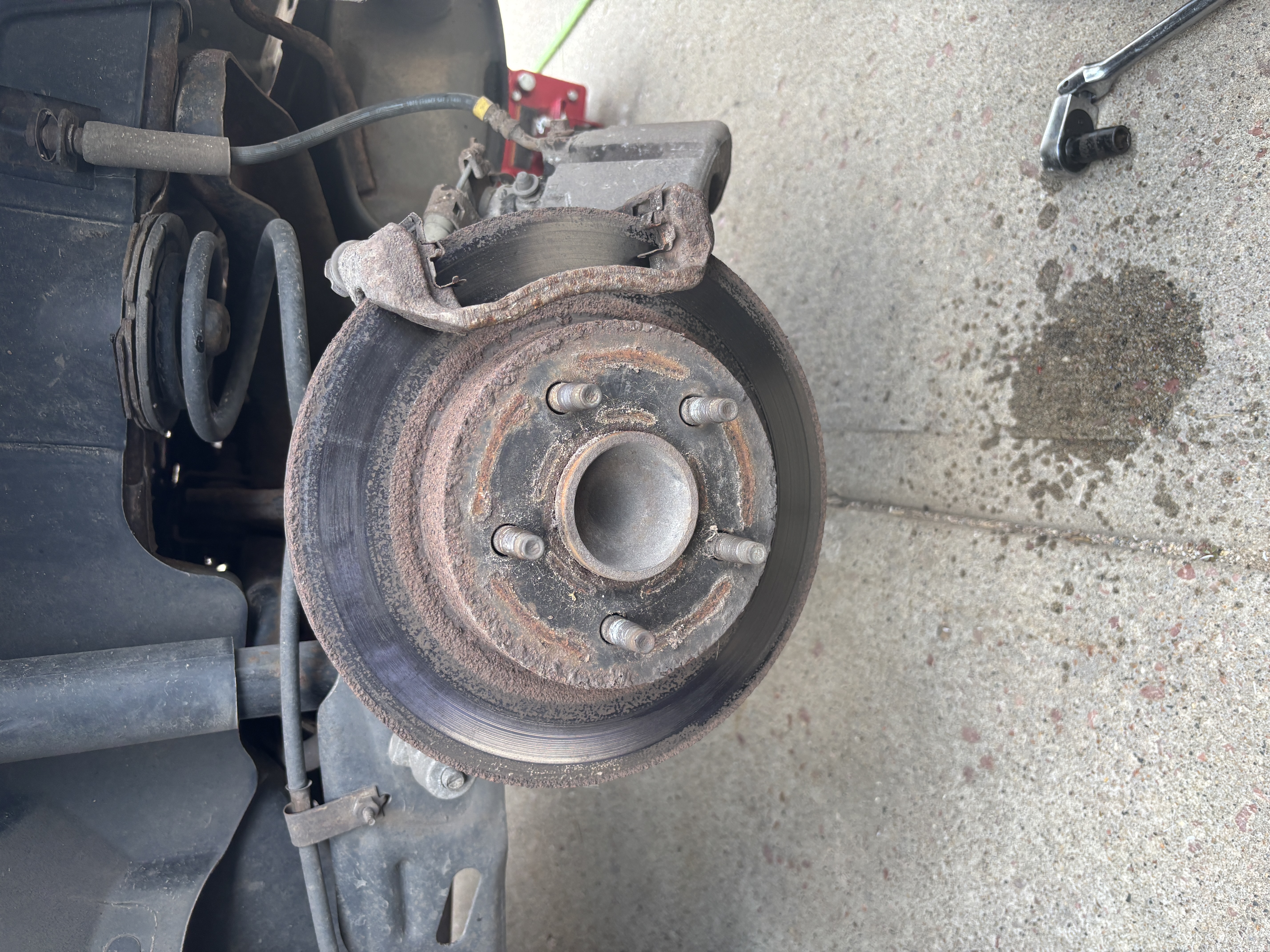 Close-up of brake rotor being replaced on vehicle