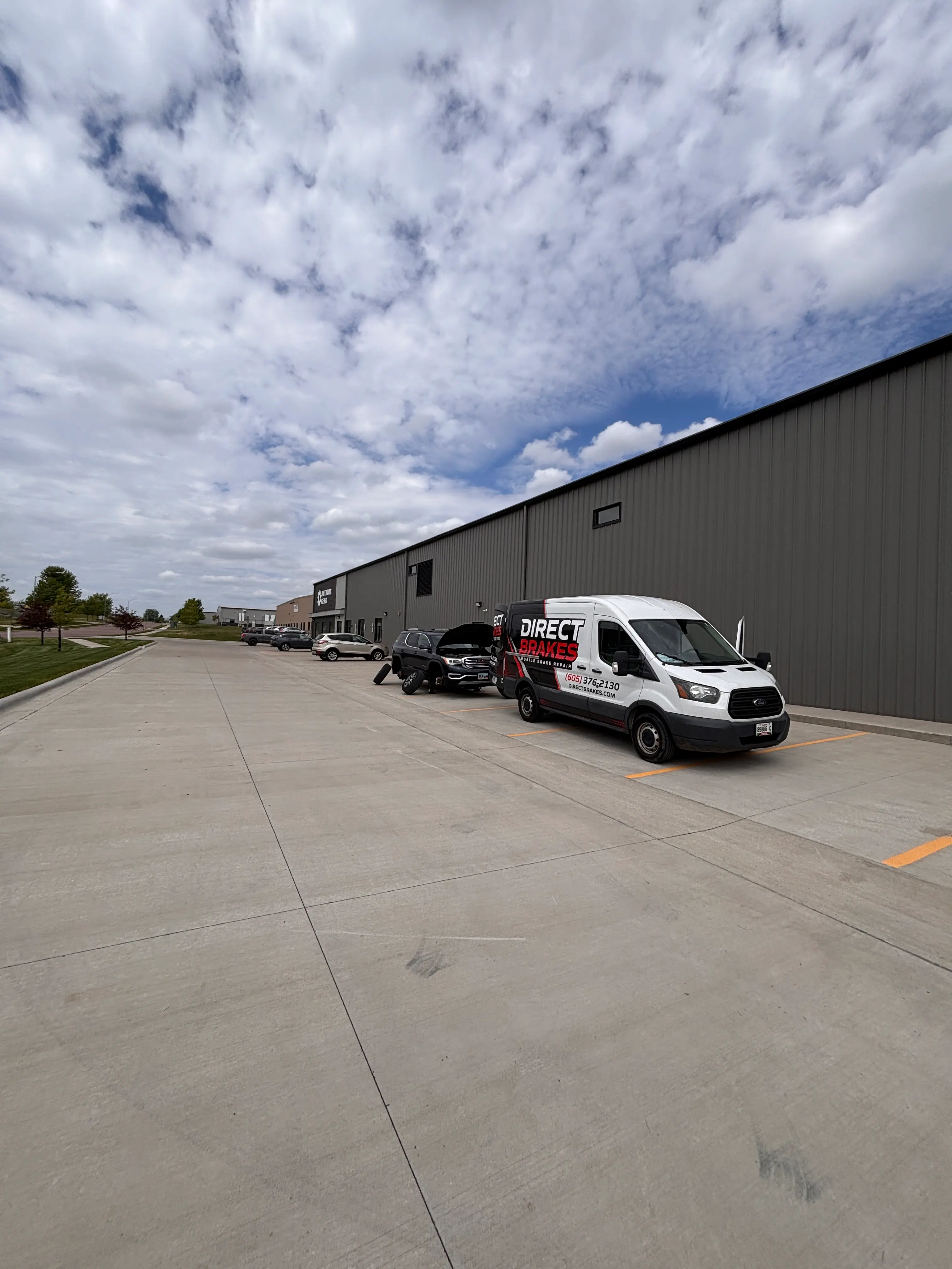 Technician performing oil change at Omaha workplace
