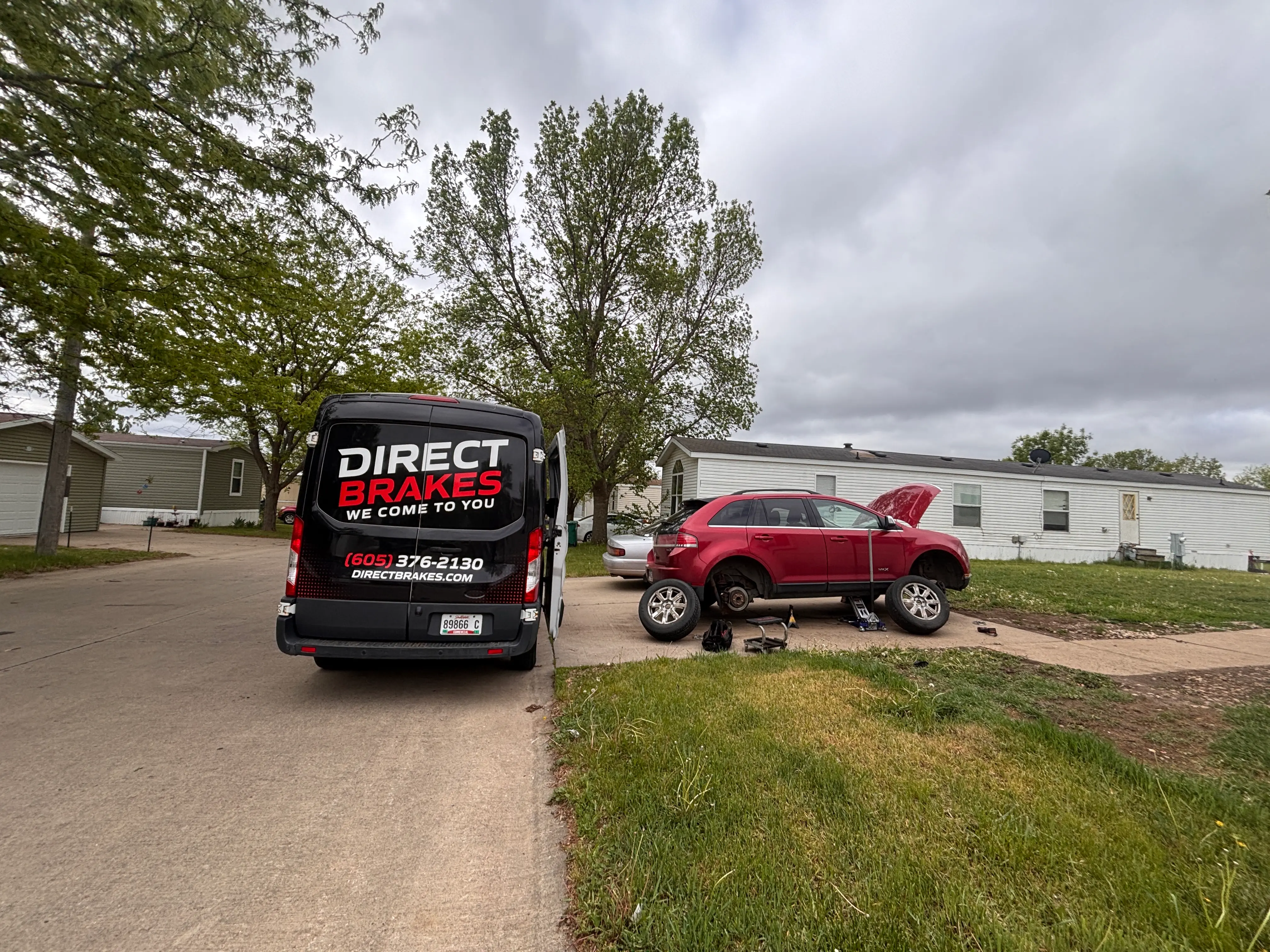 Direct Brakes technician performing mobile brake rotor replacement in Omaha